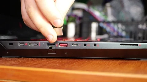Closeup of usb connector in laptop. Inside the connector is a flash drive. The m Stock Footage 99108409
