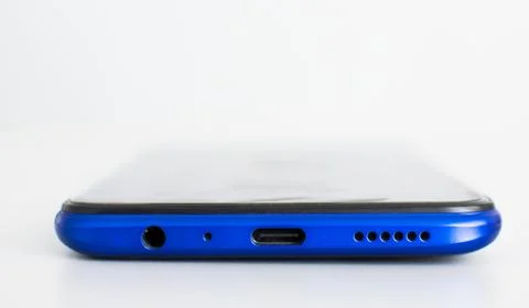Closeup, USB Type-C charging port, 3.5mm speaker jack, microphone at the bottom Stock Photos