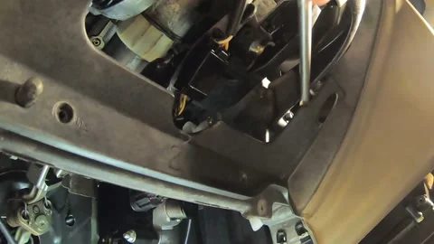 A Closeup of Using a Magnet to Retrieve a Bolt Stock Footage 146750155