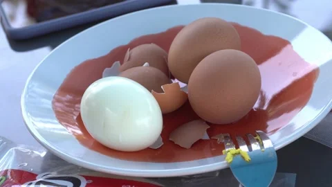 Closeup of various eggs boiled with shell and without shell on a plate on the Stock Footage 161938653