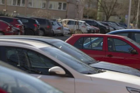 Closeup of vehicles and reflective windshields in city environment Stock Photos