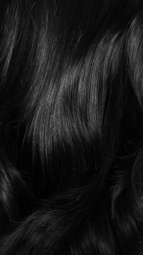Closeup vertical long hair texture in slow motion, black curly hair background Video stock 290840392