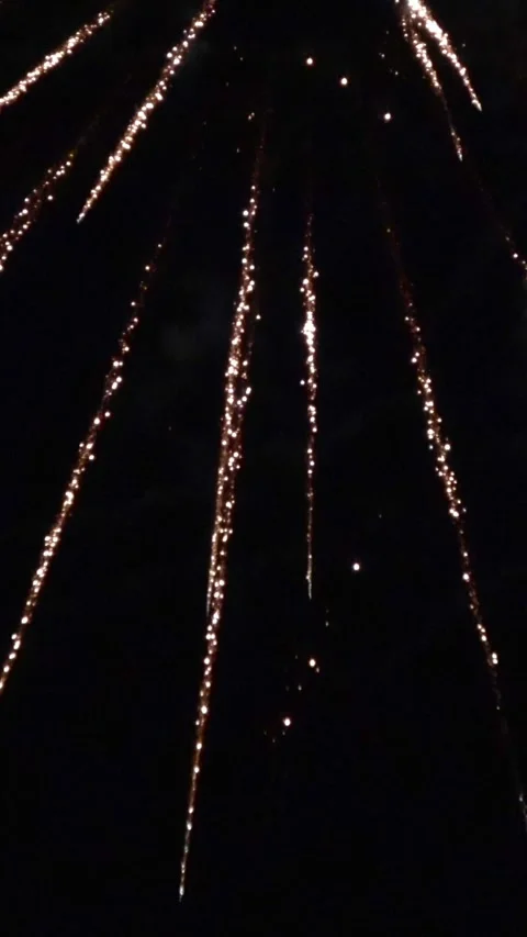 Closeup vertical looping footage of fireworks bursting in the night sky. 4K Stock-Footage 342683273