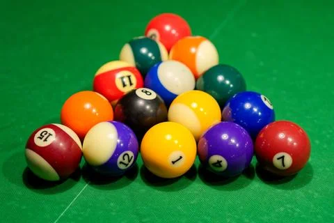 Closeup of a vibrant array of pool balls are arranged in a classic triangle form Stock Photos