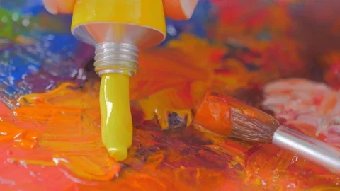 Closeup of Vibrant multi colored oil paints on a wooden palette Stock Footage 81008235