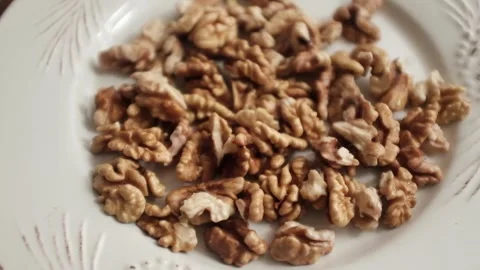 Closeup video of activated hydrated walnuts in a bowl. Stock Footage 322171777