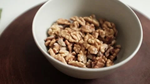 Closeup video of activated hydrated walnuts in a bowl. Stock Footage 322171782