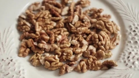 Closeup video of activated hydrated walnuts in a bowl. Stock Footage 322171792