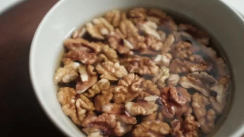 Closeup video of activated hydrated walnuts in a bowl. 库存影片 322171829