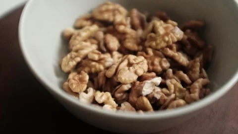 Closeup video of activated hydrated walnuts in a bowl. Stock Footage 322171837
