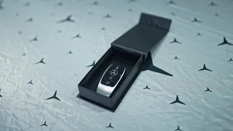 A closeup video of a beautiful small black box with Mercedes Benz car key Stock Footage 314204828
