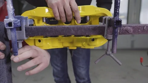 Closeup video of a ceramic brake. Ceramic is used in high performacnce brakes Stock Footage 98839239