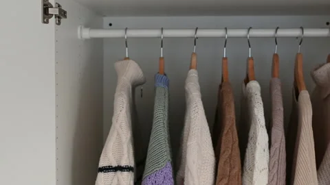 Closeup video of clothes in a hanging locker Stock Footage 168732823