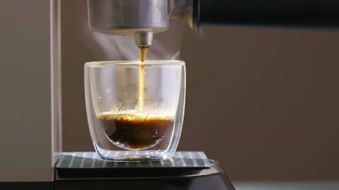 Closeup Video Of A Coffee Machine Brewing A Fresh Espresso Shot Stock Footage 338994325