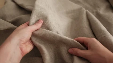 Closeup video of hands touching rough linen fabric. Stock Footage 317094145