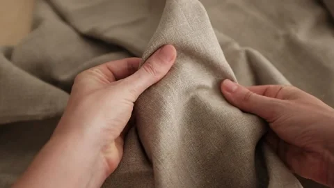 Closeup video of hands touching rough linen fabric. Stock Footage 317094195