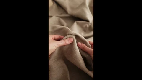 Closeup video of hands touching rough linen fabric. Stock Footage 317094326