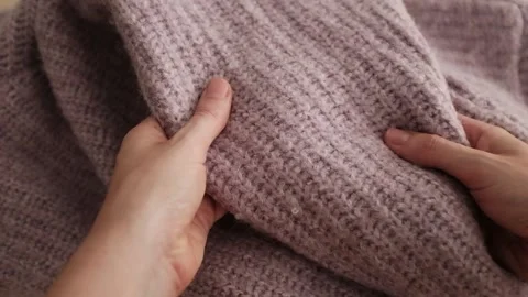 Closeup video of hands touching soft knitted fabric Stock Footage 317094111