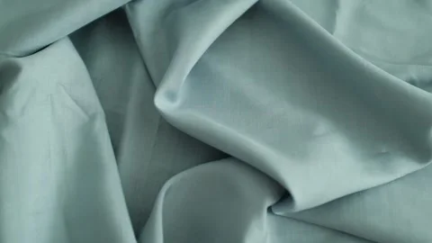 Closeup video of hands touching soft blue silk fabric. Stock Footage 317094135