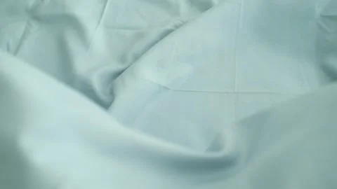 Closeup video of hands touching soft blue silk fabric. Stock Footage 317094188