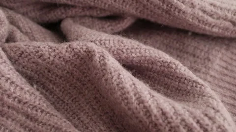 Closeup video of hands touching soft knitted fabric Stock Footage 317094202