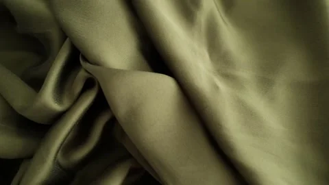 Closeup video of hands touching soft green silk fabric Video stock 317094212