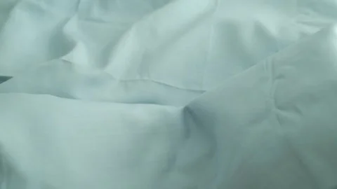 Closeup video of hands touching soft blue silk fabric. Video stock 317094220