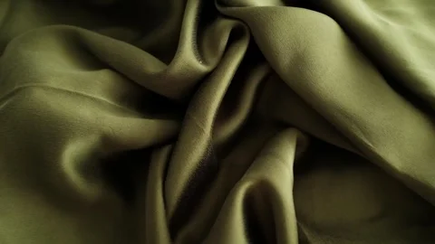 Closeup video of hands touching soft green silk fabric Stock Footage 317094232