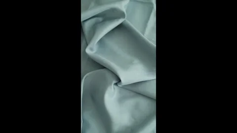 Closeup video of hands touching soft blue silk fabric. Stock Footage 317094247