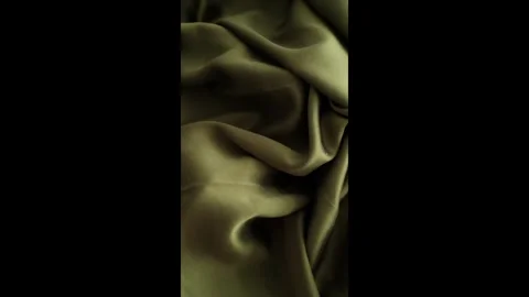 Closeup video of hands touching soft green silk fabric 库存影片 317094261