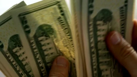 Closeup video of man hands counting american dollars banknotes on white bac.. Stock Footage 266476053