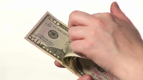 Closeup video of man hands counting american dollars banknotes on white bac.. Video stock 266476383