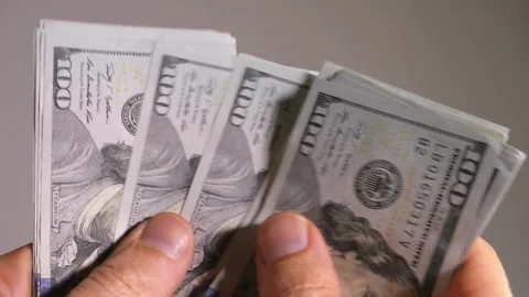 Closeup video of man hands counting american dollars banknotes on white Stock-Footage 336264875
