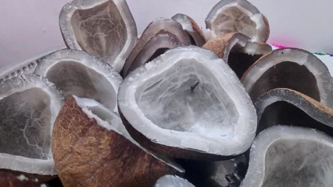 A closeup video of pile of dry cut coconut pieces for sale at indian market Stock Footage 314031844