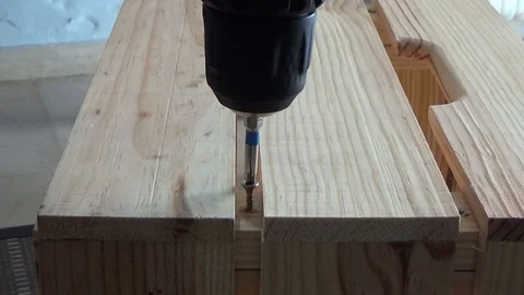 Closeup video of slow electric screwdriver building wooden crate Stock Footage 111721853