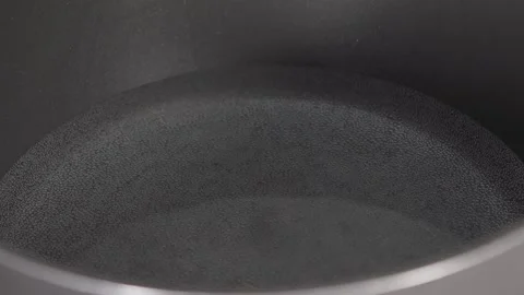 Closeup Video of Water Boiling in Pan Stock Footage 217657399
