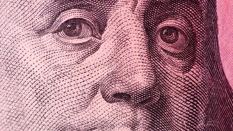 Closeup view of 100 US dollars banknotes under the light of a police siren. Stock Footage 289335181