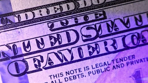 Closeup view of 100 US dollars banknotes under the light of a police siren. Stock Footage 289335672