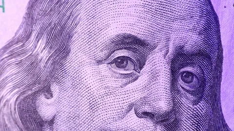 Closeup view of 100 US dollars banknotes under the light of a police siren. Stock Footage 289335787