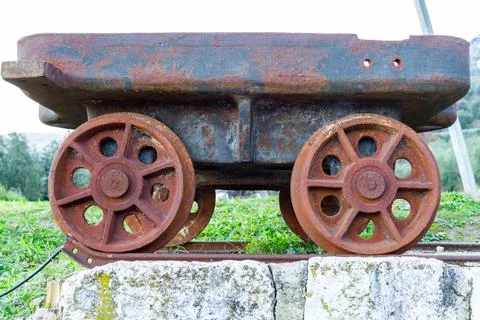 Closeup view of an abandoned rusty mining wagon. Concept: lead, silver, copper Stock Photos