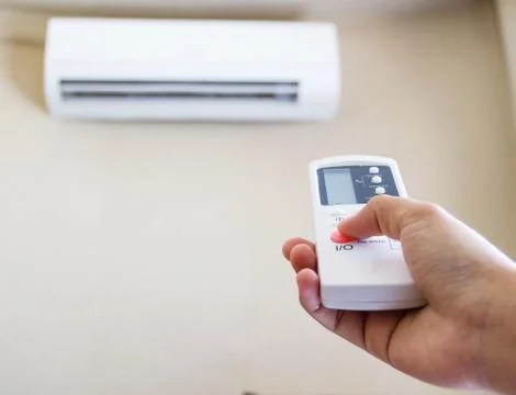 Closeup view about using some appliance such as air condition. Stock Photos