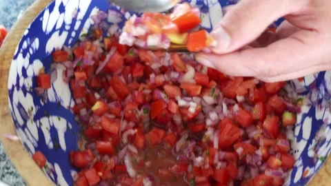 Closeup of a view from above serving with a spoon several mussels a la chalaca Stock Footage 189150634