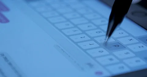 Closeup view adult using virtual keyboard on tablet device to send message on Stock Footage 95626356