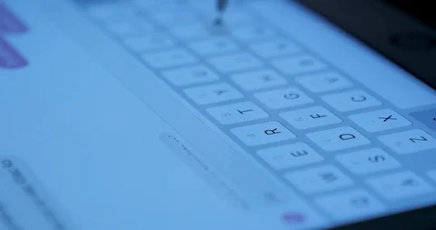 Closeup view adult using virtual keyboard on tablet device to send message on Stock Footage 95627491