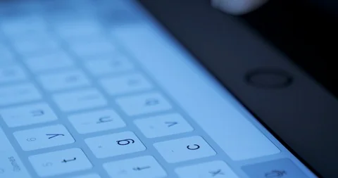 Closeup view adult using virtual keyboard on tablet device to send message on Stock Footage 95628565