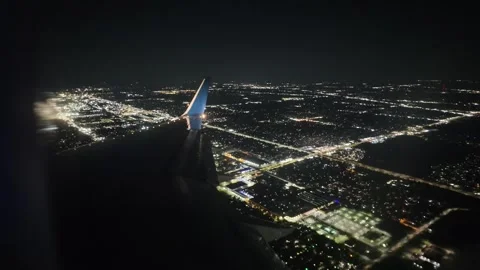 Closeup View of Airplane Wing Over Detroit City at Night Stock Footage 319030517