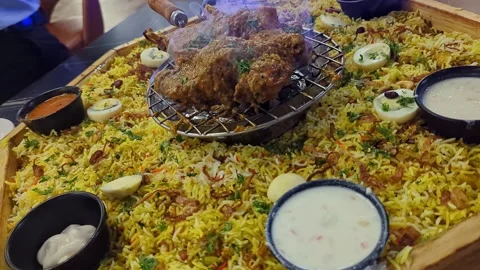 Closeup view of Arabian mandi biryani with tandoor cooked meat served on plat Stock Footage 335880332