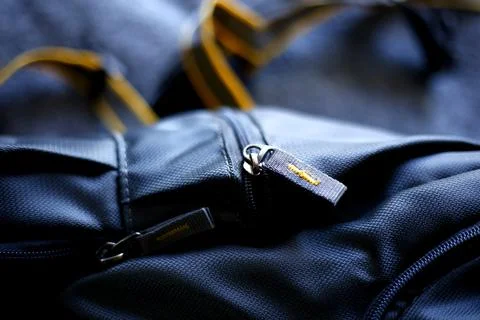 Closeup view of backpack, Grey and yellow Travel bag backside view Stock Photos