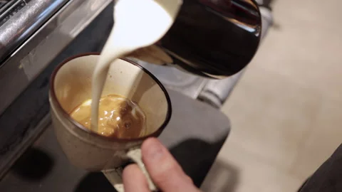 Closeup view of barista preparing hot coffee drink and standing in cafe kitchen Stock Footage 156877855