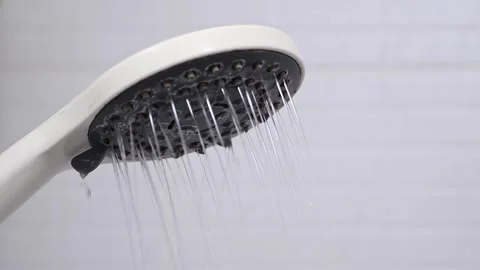 Closeup view of bathroom hand shower with water stream. Stock Footage 282907435